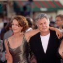 Actor Tony Curtis attends an awards ceremony in Hollywood with his daughter Jamie Lee Curtis and his wife Lisa