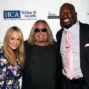Jenn Brown, Vince Neil, and Titus O'Neil attend the 16th Annual Waiting for Wishes Celebrity Dinner Hosted by Kevin Carter & Jay DeMarcus on April 18, 2017 in Nashville, Tennessee.