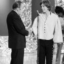 Mick with Ed Sullivan at the end of the Stones' performance of "Gimme Shelter" on what would be their last appearance on The Ed Sullivan show