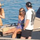 Logan Paul and Nina Agdal share a loved up afternoon on the Mediterranean as they enjoy their romantic Greek vacation