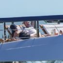 Victoria Beckham – In a black swimsuit on a yacht in Miami