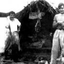 Alberto Granado (left) with Guevara (right) aboard their "Mambo-Tango" wooden raft on the Amazon River in June 1952. The raft was a gift from the lepers whom they had treated