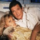 Roger Moore and Mary Stavin