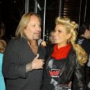 Motley Crew frontman Vince Neil laughs with his "Skating with the Stars" partner Jennifer Wester. Vince and Jennifer joined other cast members to dine out at BOA Steakhouse in West Hollywood