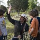 Director ROBERT RODRIGUEZ (center) explains a scene to LEO HOWARD, TREVOR GAGNON and REBEL RODRIGUEZ on the set of Warner Bros. Pictures' magical fantasy adventure 'Shorts.' Photo by Van Redin