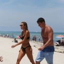Kayla Rae Reid in Black Bikini on the beach in Miami