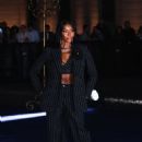 Naomi Campbell flashes her toned abs in a skimpy crop top beneath a chic suit as she arrives at star-studded Dolce & Gabbana event in Milan