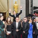 Actor Benedict Cumberbatch jumps behind U2 at the 86th Annual Academy Awards in Hollywood (2014)