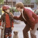Pistachio (Dana Carvey) helps Barney (Austin Wolff) ride his skateboard