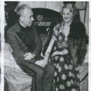 Hand holding between the 43 yr old playboy and his secretary, blonde Dolly Goering