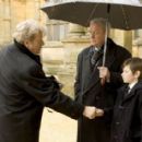 (L-R) RUTGER HAUER as Richard Earle, MICHAEL CAINE as Alfred Pennyworth and GUS LEWIS as Young Bruce Wayne in Warner Bros. Pictures action adventure Batman Begins, starring Christian Bale.
