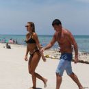 Kayla Rae Reid in Black Bikini on the beach in Miami