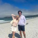 Tess Daly looked gorgeous in a white mini skirt while on the beach with husband Vernon Kay