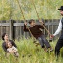 (L-r) MARY-LOUISE PARKER as Zee James, BROOKLYNN PROULX as Mary James, DUSTIN BOLLINGER as Tim James and BRAD PITT as Jesse James in Warner Bros. Pictures’ and Virtual Studios’ drama “The Assassination of Jesse James by the Coward Robert
