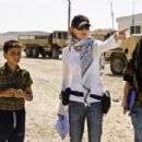 Director KATHRYN BIGELOW (white shirt) and Writer MARK BOAL (far left) on the set of THE HURT LOCKER. Photo: Jonathan Olley. All photos: © 2009 Summit Entertainment. All rights reserved.