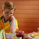 (from l. to r.) George (Jonathan Lipnicki) and Stuart (voiced by Michael J. Fox) share breakfast and brotherly advice together in Stuart Little 2 - 2002
