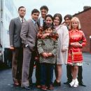 From left to right: Emil Marwa, Raji James, Chris Bisson, Archie Panjabi, Jordan Routledge (front), Ruth Jones, Jimi Mistry and Emma Rydal in Miramax's East Is East - 2000