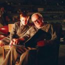 Burt Munro (Anthony Hopkins) reads to Tom (Aaron Murphy) in his workshop in The World's Fastest Indian , a Magnolia Pictures release. Photo courtesy Raoul Butler.