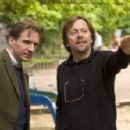 Ralph Fiennes (left) and Fernando Meirelles (right) on the set of THE CONSTANT GARDENER, a Focus Features release.  Photo by Jaap Buitendijk.