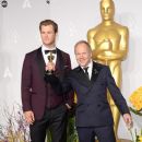 Chris Hemsworth and the winner Glenn Freemantle At The 86th Annual Academy Awards (2014)