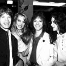 Mick Jagger, Jerry Hall, Alan Merrill and Cathee Dahmen. Party at Mr. Chow restaurant New York in celebration of “I Love Rock N Roll” reaching #1 in 1982. Arrows lead singer Alan Merrill wrote and recorded the original 1975 Arrows version of “I Love Rock