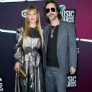Chris Robinson of The Black Crowes  and Camille Johnson at the 2023 CMT Music Awards held at Moody Center on April 2, 2023 in Austin, Texas
