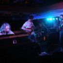 (L-R) Adam MacDougall, Guitarist Neal Casal and Lead singer Chris Robinson of the music group Chris Robinson Brotherhood perform on stage at Luxury Infinity Yacht on June 6, 2014 in New York City.