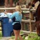 Reese Witherspoon – Taking selfies with local horses in Los Angeles
