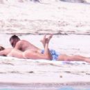 Taylor Swift – In a bikini With Travis Kelce seen at a beach getaway together