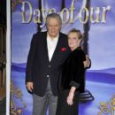 John Aniston and Sherry Rooney poses for a picture at the "Days Of Our Lives" 45th Anniversary Party