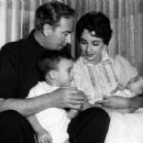 Elizabeth Taylor and husband Michael Wilding with their newborn Christopher Wilding while son Michael Wilding Jr looks on, 1955.
