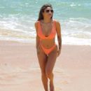 Kayleigh Morris – In orange bikini on the beach in Cyprus