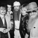 Motörhead drummer ‘Philthy Animal’ Taylor, Billy Gibbons and Dusty Hill from ZZ Top and Phil Collen from Def Leppard in between Billy and Dusty at the London's most famous gentlemen's club Stringfellows, 1984