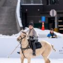 Joyce Bonelli – Gets on horseback for snow polo in Aspen