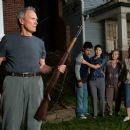 (L-r) Walt Kowalski (CLINT EASTWOOD), Thao (BEE VANG), Vu (BROOKE CHIA THAO), Grandma (CHEE THAO) and Sue (AHNEY HER) in Warner Bros. Pictures' and Village Roadshow Pictures' drama 'Gran Torino,' distributed by Warner Bros. Pictures. Photo