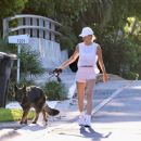 Gisele Bundchen – Enjoys a morning walk with her dog in Miami Beach