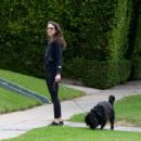 Troian Bellisario – Out for a walk with her dog in Los Angeles