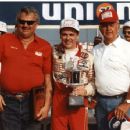 October 20, 1984 - Robert Gee in red shirt and "Papa Joe" Hendrick flank Geoff Bodine at Rockingham as they accept hardware for winning the pole position. Hendrick Motorsports photo