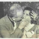 Tommy Manville, asbestos heir and rich playboy, here is shown as he last night kissed the blonde he has chosen for his fifth wife. His latest choice, Miss Nina Pierson of Duluth, now is a guest of Manville at the suburban New York estate