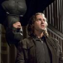 CHRISTIAN BALE starring as Batman and DAVID MURRAY in Warner Bros. Pictures action adventure Batman Begins.
