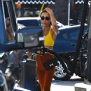 Maggie Q – Spotted fueling her car in Los Angeles