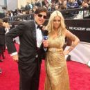 Mayra Dias Gomes and Dr. Rey on the Oscars red carpet