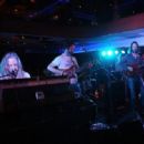 (L-R) Adam MacDougall, Guitarist Neal Casal and Lead singer Chris Robinson of the music group Chris Robinson Brotherhood perform on stage at Luxury Infinity Yacht on June 6, 2014 in New York City.