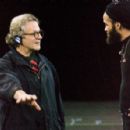 Director GEORGE MILLER directs tap dancer SAVION GLOVER on the motion capture stage during filming for Warner Bros. Pictures’ and Village Roadshow Pictures’ comedy adventure “Happy Feet,” distributed by Warner Bros. Pictures. Photo