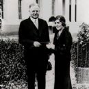 Mary Pickford giving President Herbert Hoover a ticket for a film industry benefit for the unemployed, 1931