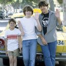 (Left to right) Michael Angarano, who plays Young William Miller, and Patrick Fugit, who stars as the 15-year-old William Miller, pose with writer/director/producer Cameron Crowe on the set of his semi-autobiographical film, Dreamworks' Almost Famous