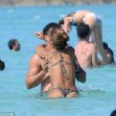 Retired footballer Ronaldo uses a selfie stick to take loved up holiday snaps in the sea with beach babe fiancé Paula Morais - 454 x 303