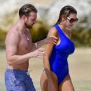 Zara McDermott – Wearing blue swimsuit on the beach in Barbados - 454 x 725
