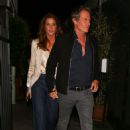 Cindy Crawford looks ultra-chic in a satin top and blazer as she heads out for a romantic dinner with husband Rande Gerber in Santa Monica - 454 x 681