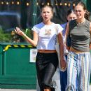 Lila Grace Moss – In crop top, black skirt and Adidas trainers in New York - 454 x 634